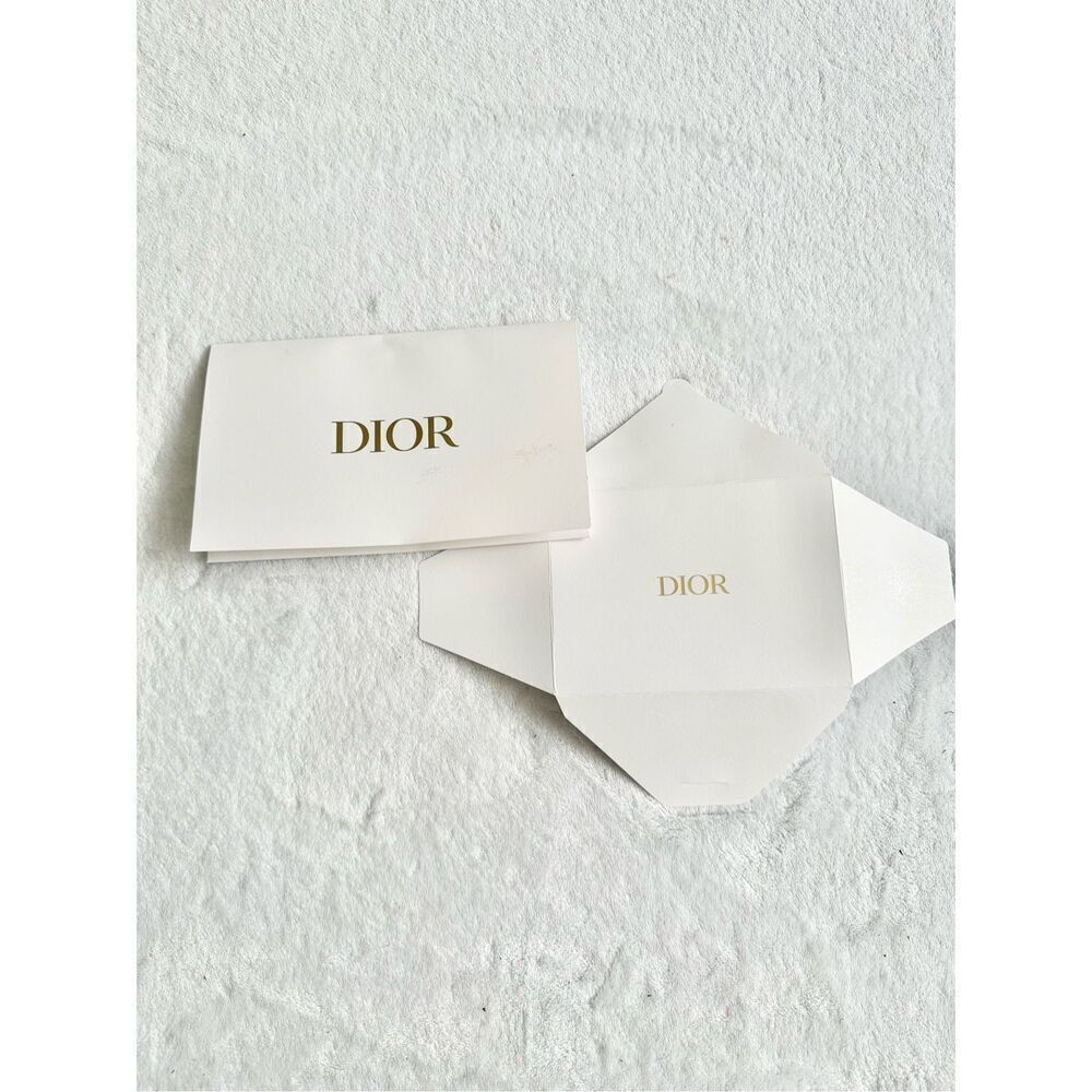 White and gold Dior envelope ￼